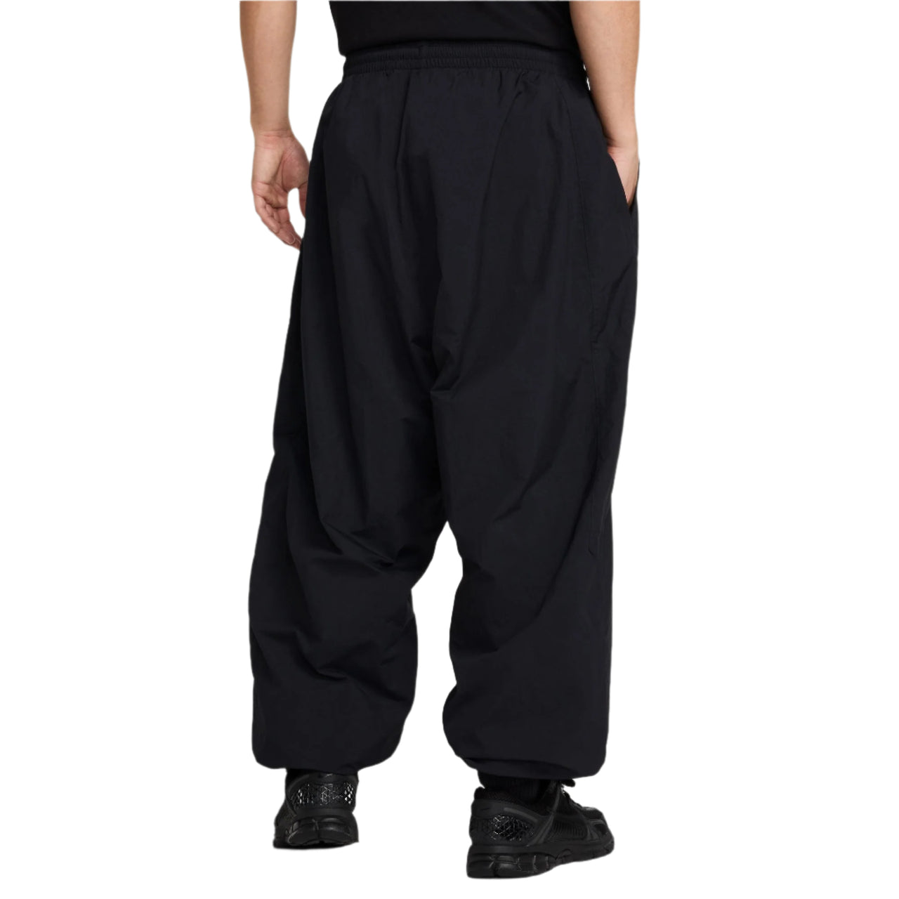 Black wide-leg pants worn by a person on a white background