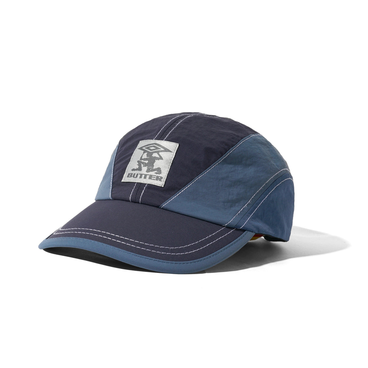 BUTTER GOODS X UMBRO - DIAMOND TERRAIN CAP - NAVY / SLATE