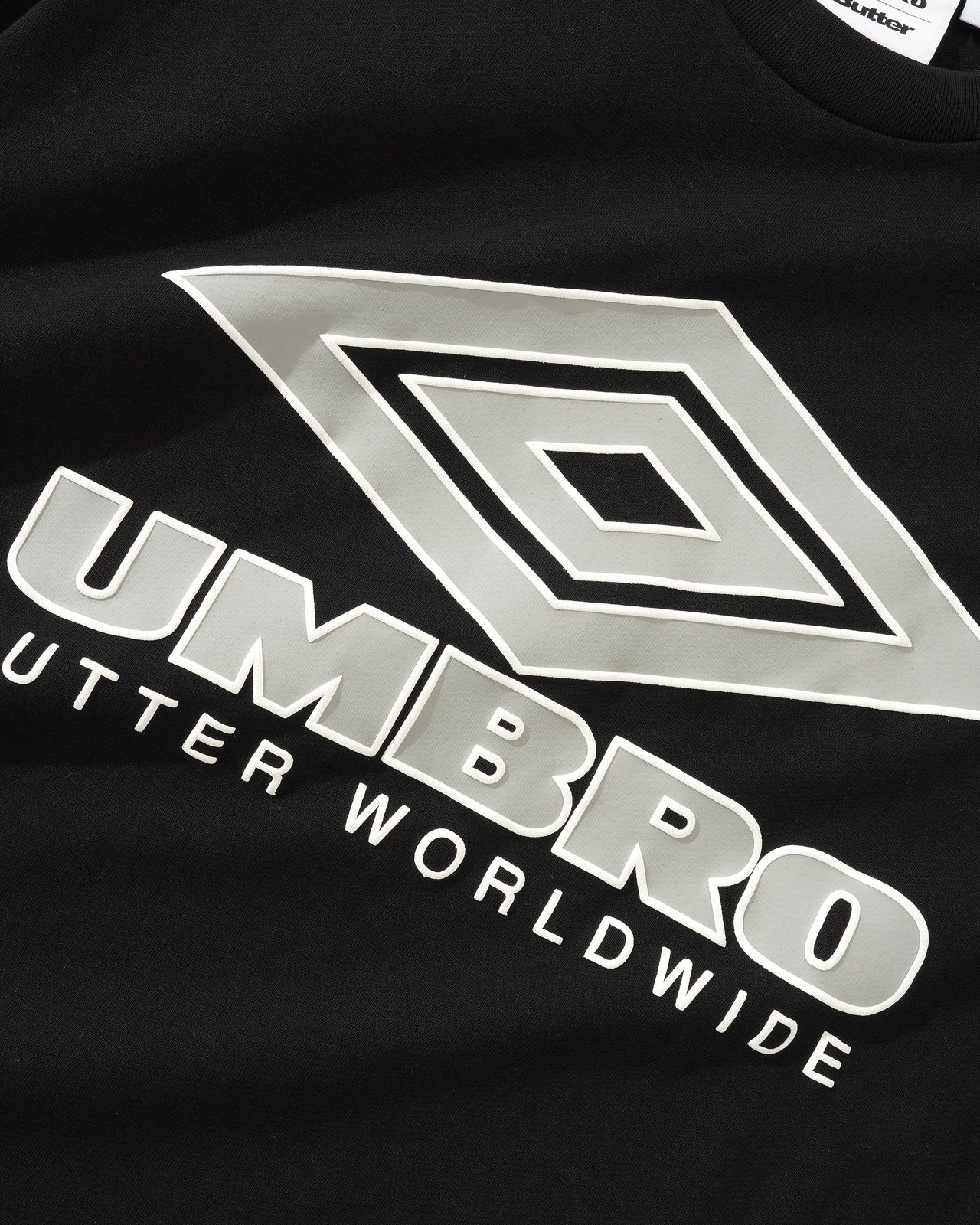 BUTTER GOODS X UMBRO - DIAMOND LOGO TEE - BLACK