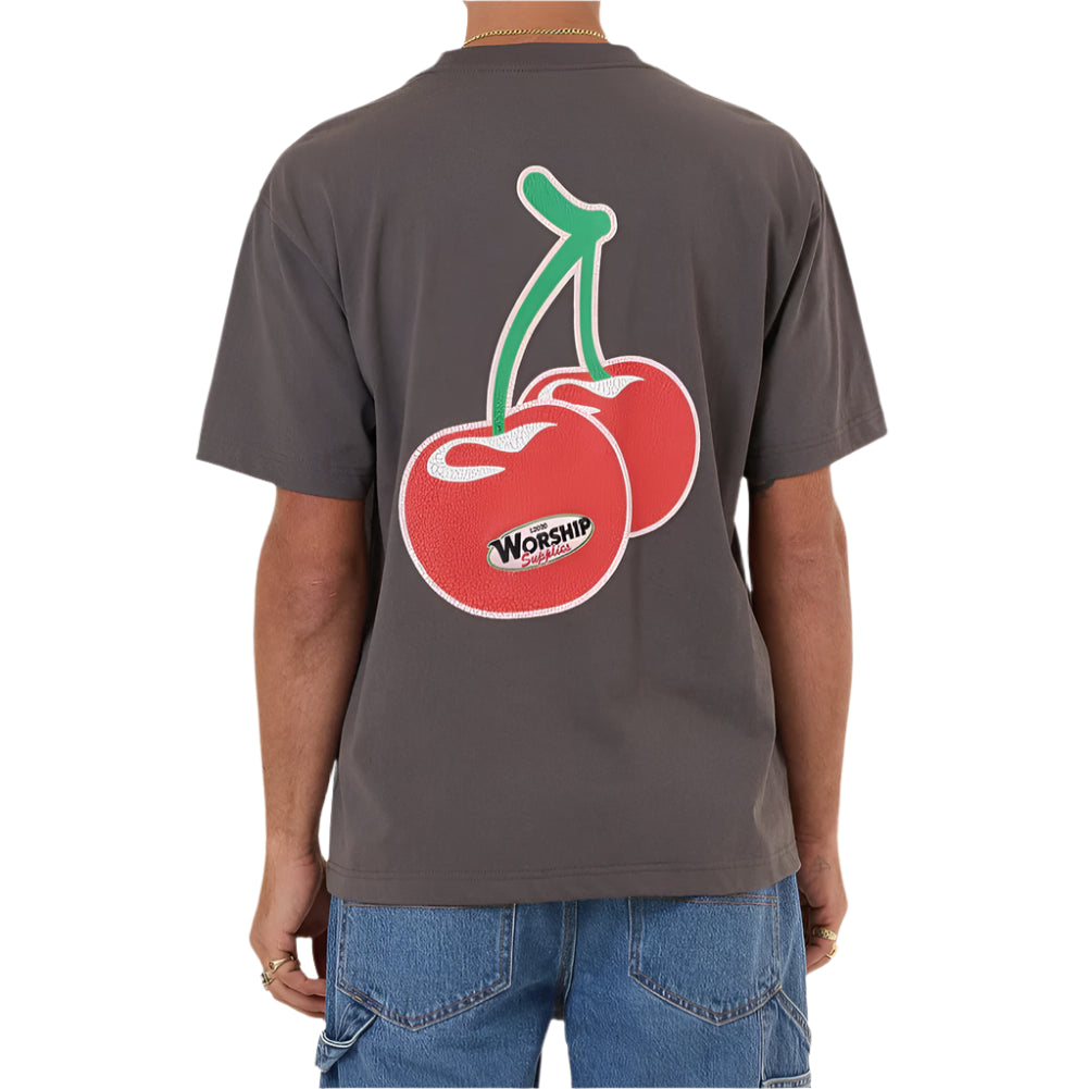 Person wearing a gray t-shirt with a cherry graphic on the back, standing against a white background.