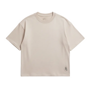 Flat lay front of cream Nike boxy t-shirt